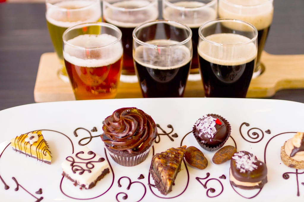 chocolate treats on plate next to beer glasses