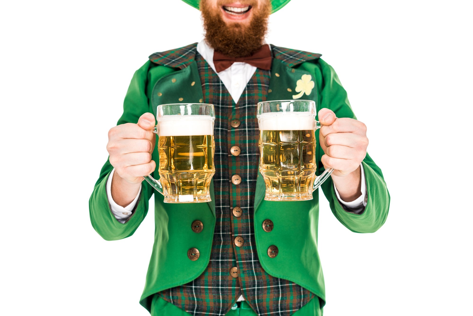 bearded man dressed as Leprechaun celebrating St Patricks Day with two pints of beer beer.